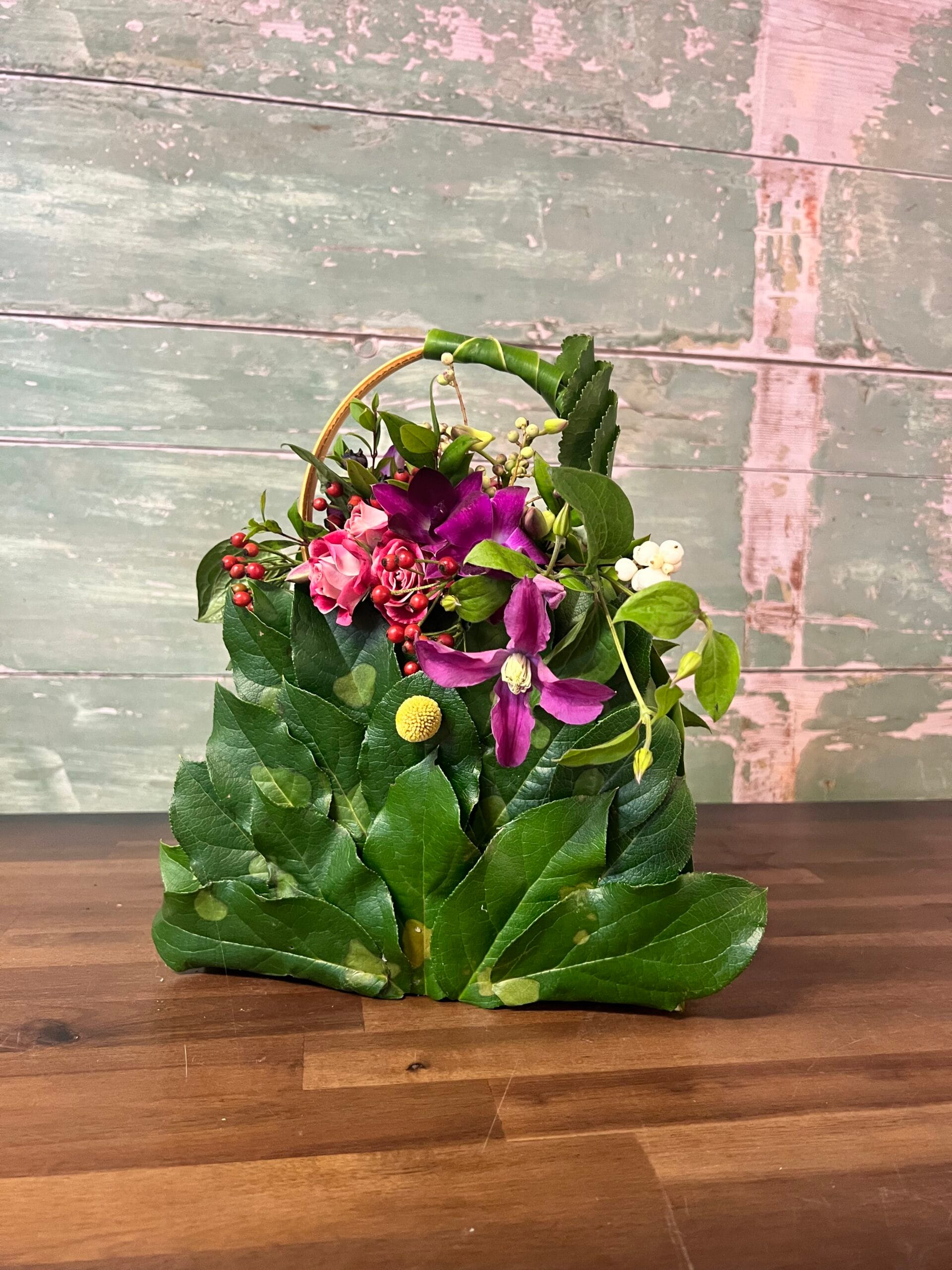 Bespoke handbag shaped funeral tribute made from leaves and flowers