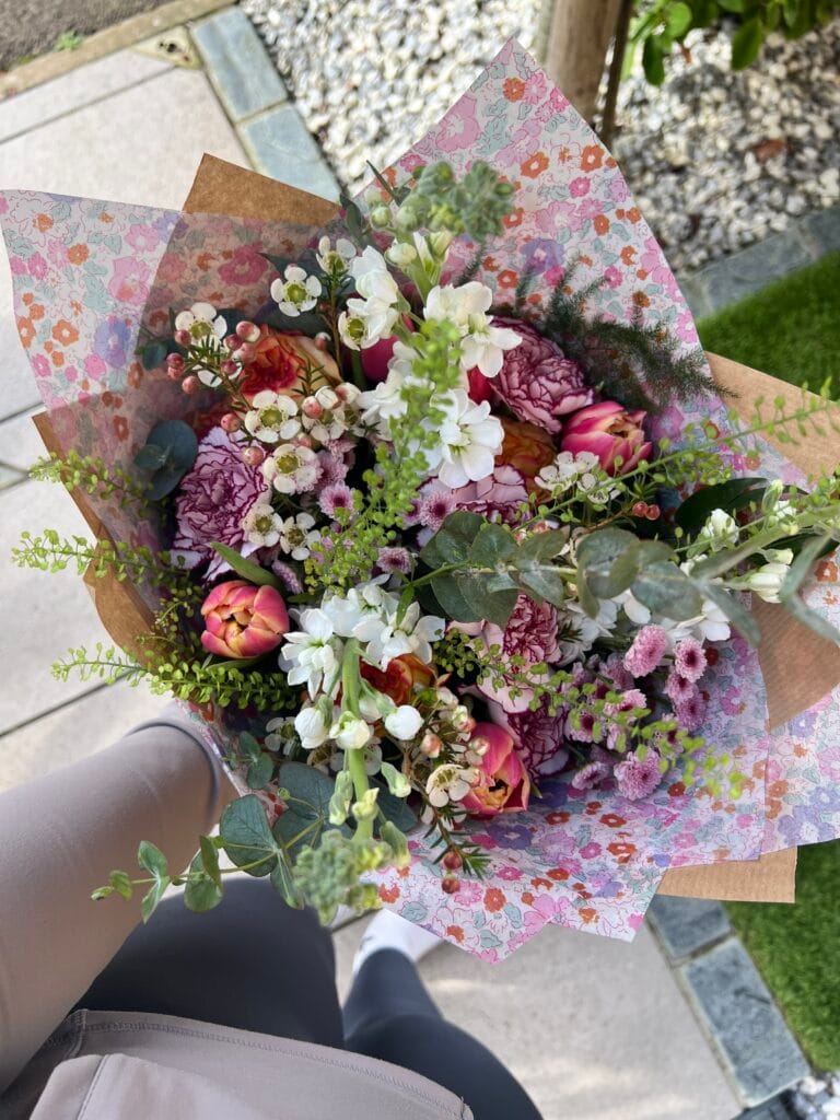 Colourful flower bouquet with wrapping paper design.