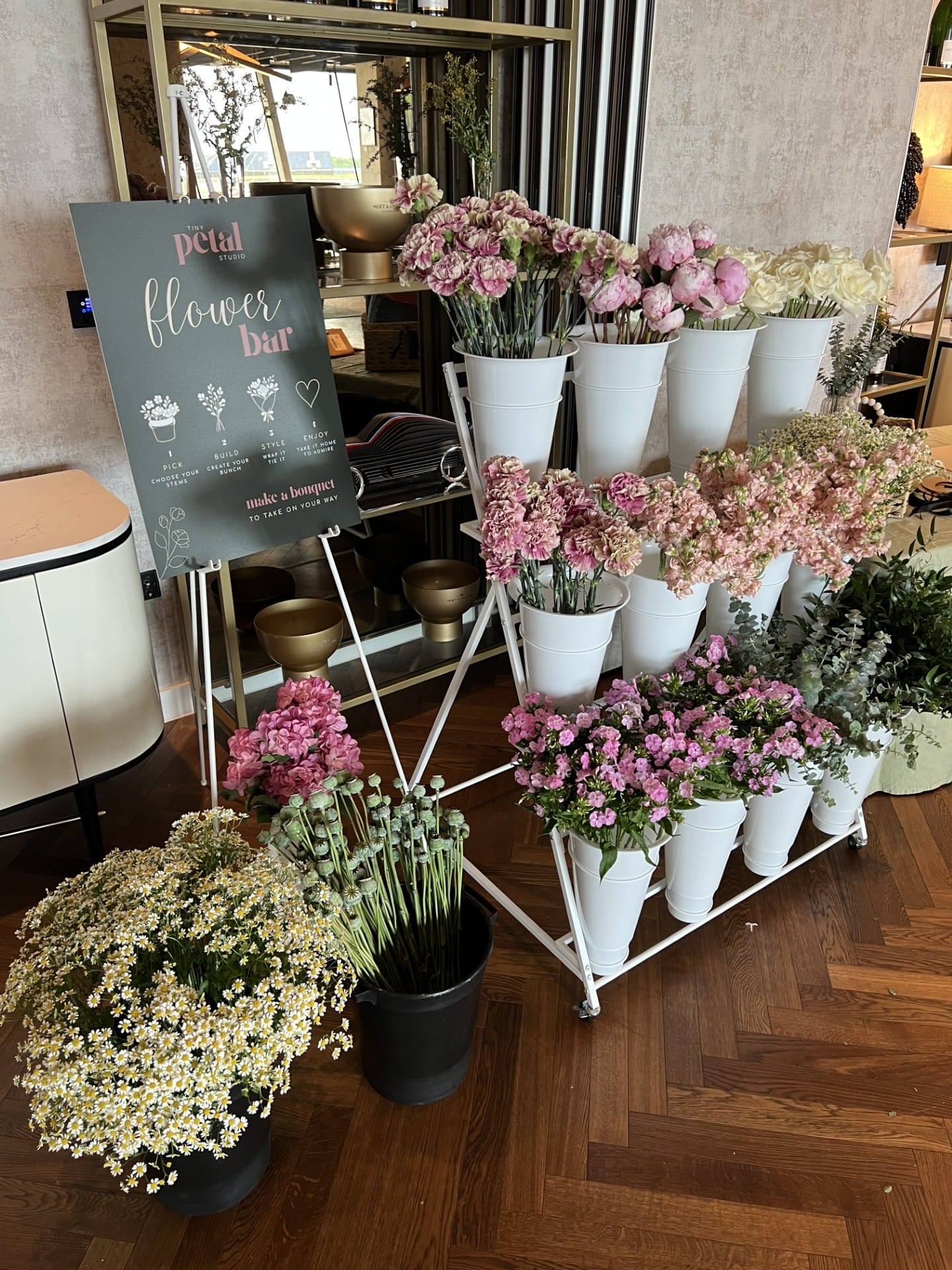 Indoor flower bar with pink and white blooms