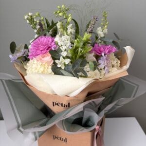 Pastel bouquet in gift box with pink flowers
